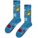 Bright blue socks featuring a yellow crab, red symbols, and playful patterns for cancer awareness an.