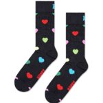 Colorful heart patterned socks with red, pink, green, blue, and white hearts on a black background.