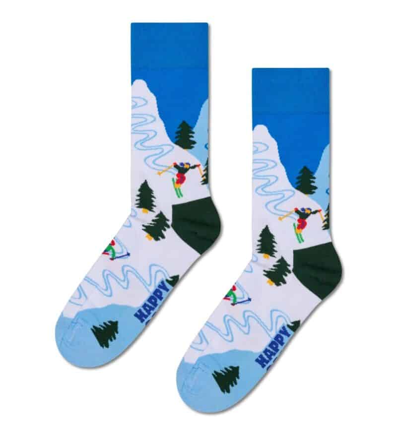 Colorful skiing socks with mountain and pine tree design.